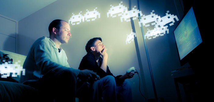 Video Game Consoles - Men playing video game Space Invaders by Patrick Brosset Creative Commons