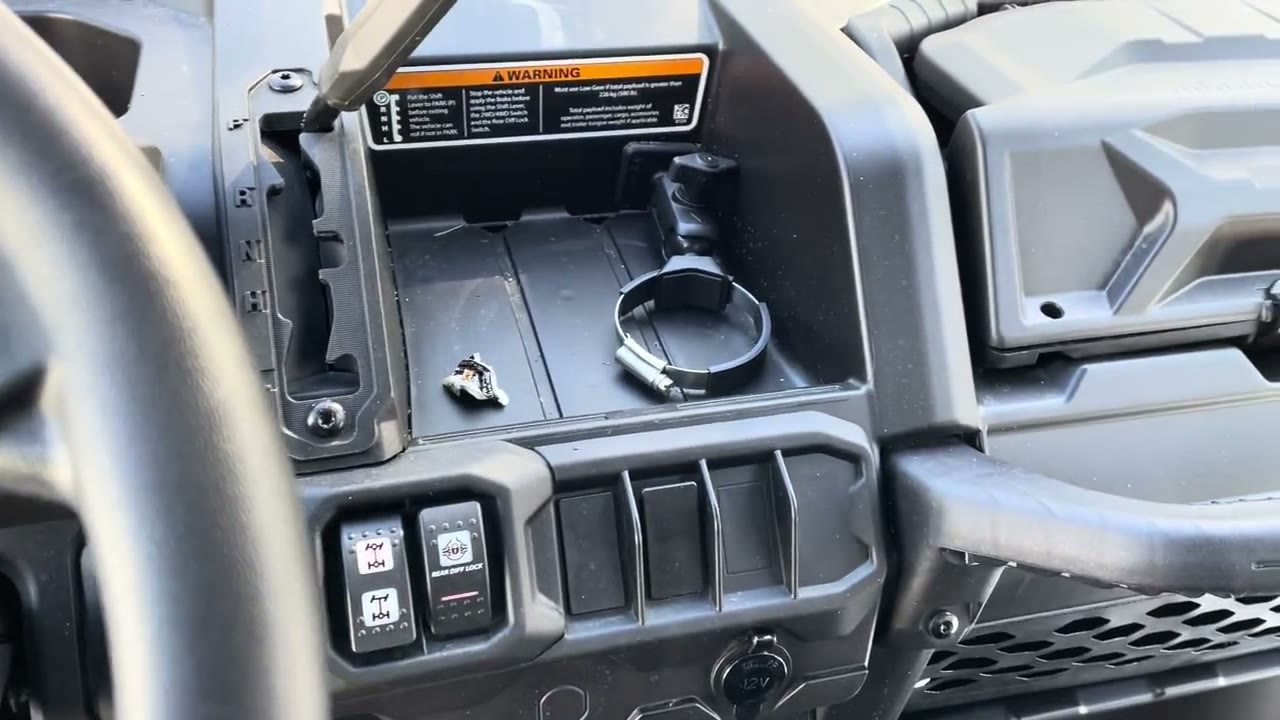Can-Am Defender dashboard switches and storage area