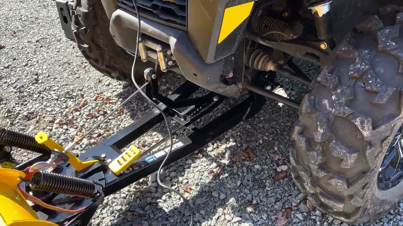 Can-Am Defender Promount snow plow installed on the front of the machine