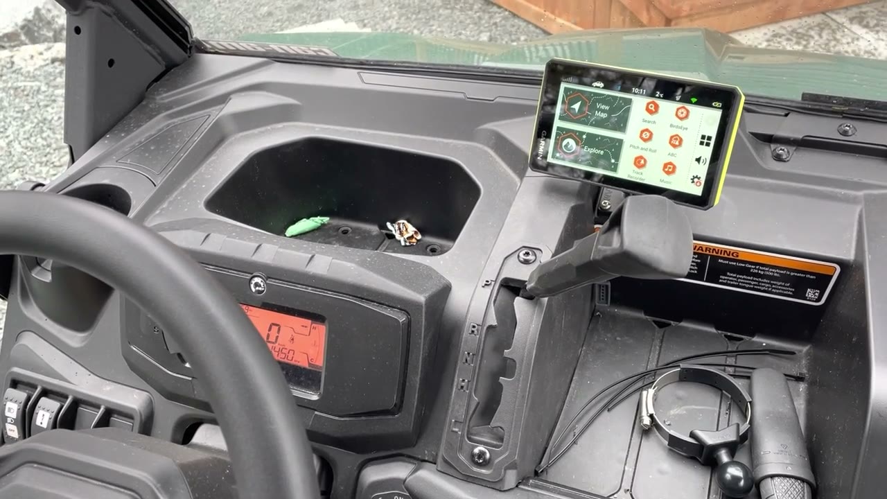 Garmin Tread GPS mounted on the dashboard of a Can-Am Defender