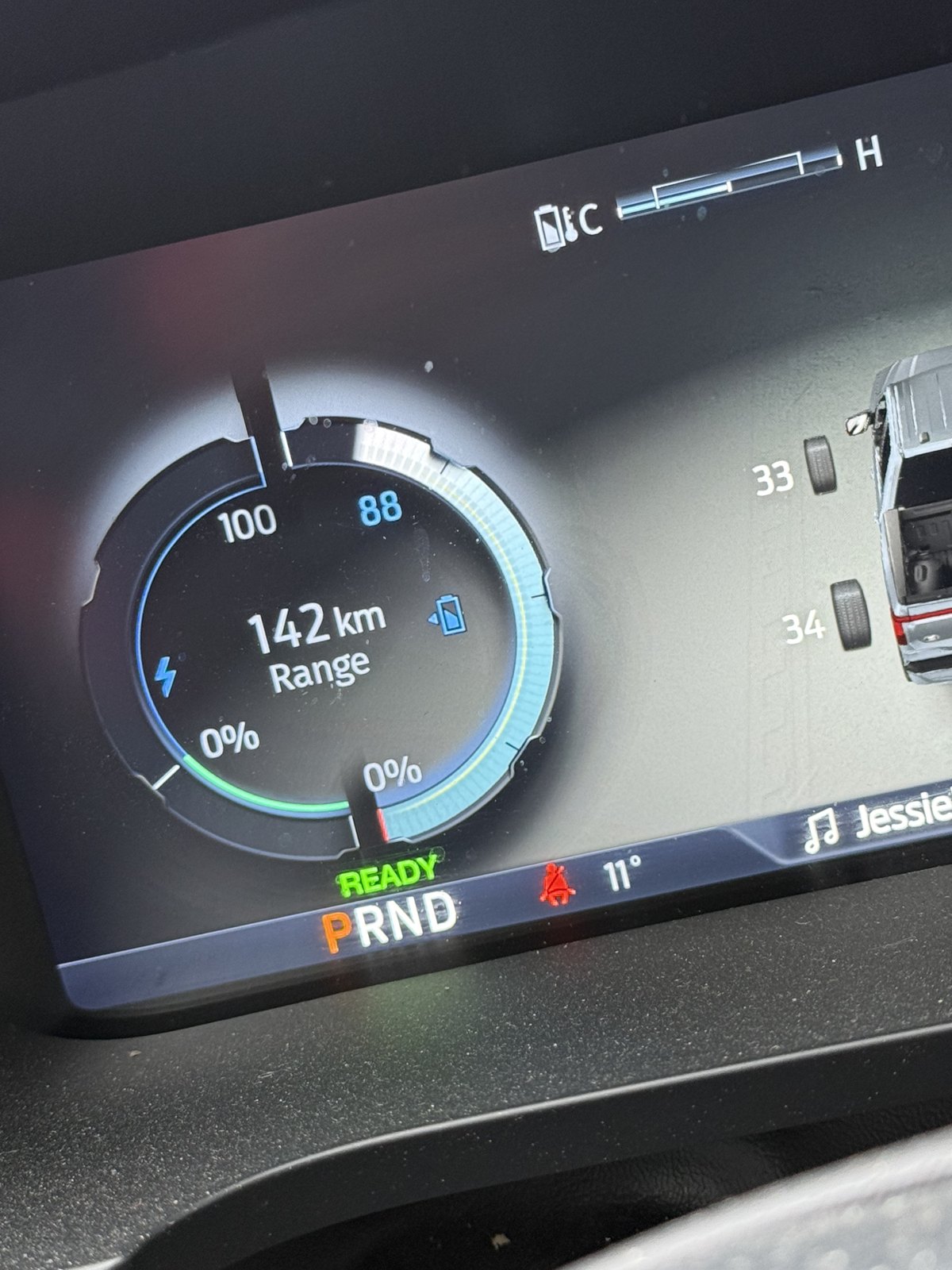 Ford F-150 Lightning display showing 88 percent battery and 142 km range with trailer profile visible