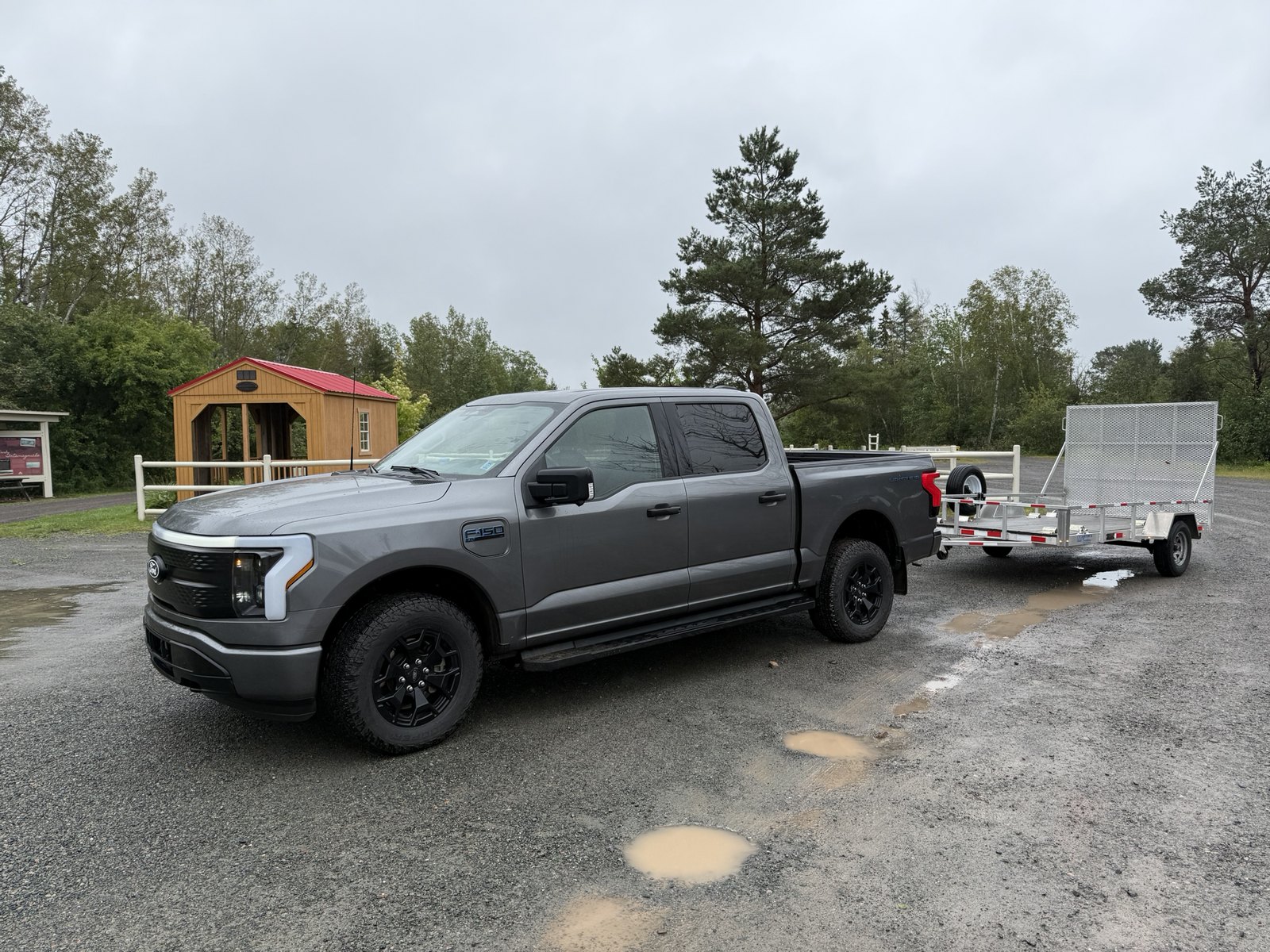 Ford F-150 Lightning and utility trailer at a Tatamagouche-area stop